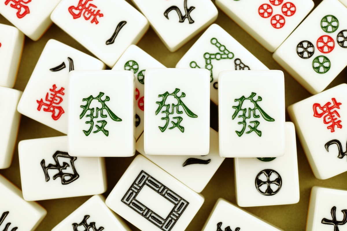Chinese mahjong tiles, close-up of mahjong tiles on green background